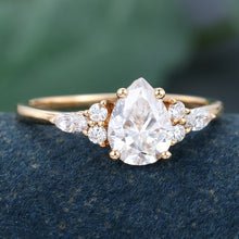 Rose Gold Pear Shaped Moissanite Cluster Engagement Ring
